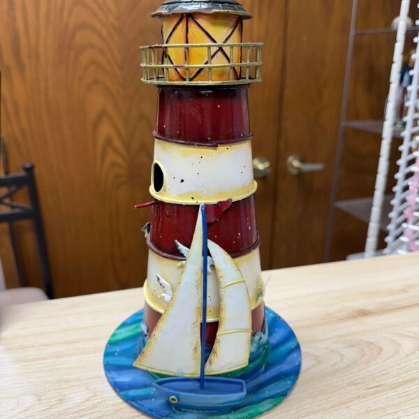 TIN LIGHTHOUSE WITH SEAGULLS AND A BOAT