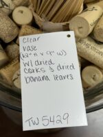 CLEAR VASE 12"H X 9" W WITH DRIED CORKS AND DRIED BANANNA LEAVES - Image 3